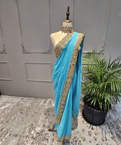 Turquoise gorgettte saree with red crystal work